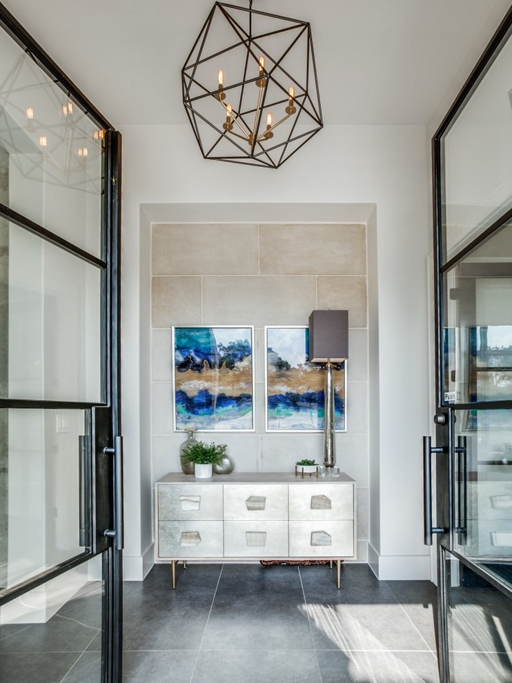 Idee per un ingresso minimalista di medie dimensioni con pareti bianche, pavimento con piastrelle in ceramica, una porta a due ante, una porta nera e pavimento grigio
