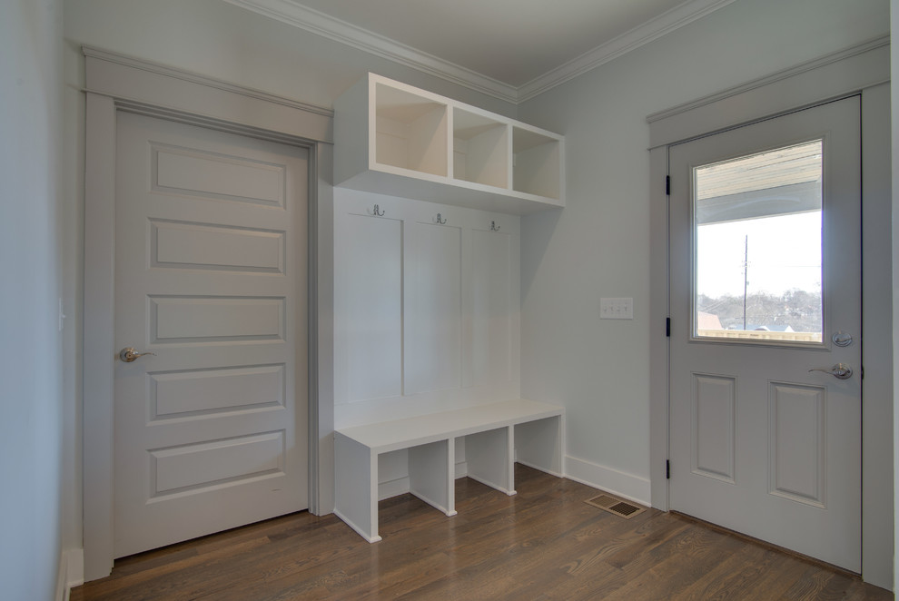 Inspiration for a mid-sized craftsman medium tone wood floor entryway remodel in Nashville with gray walls and a gray front door
