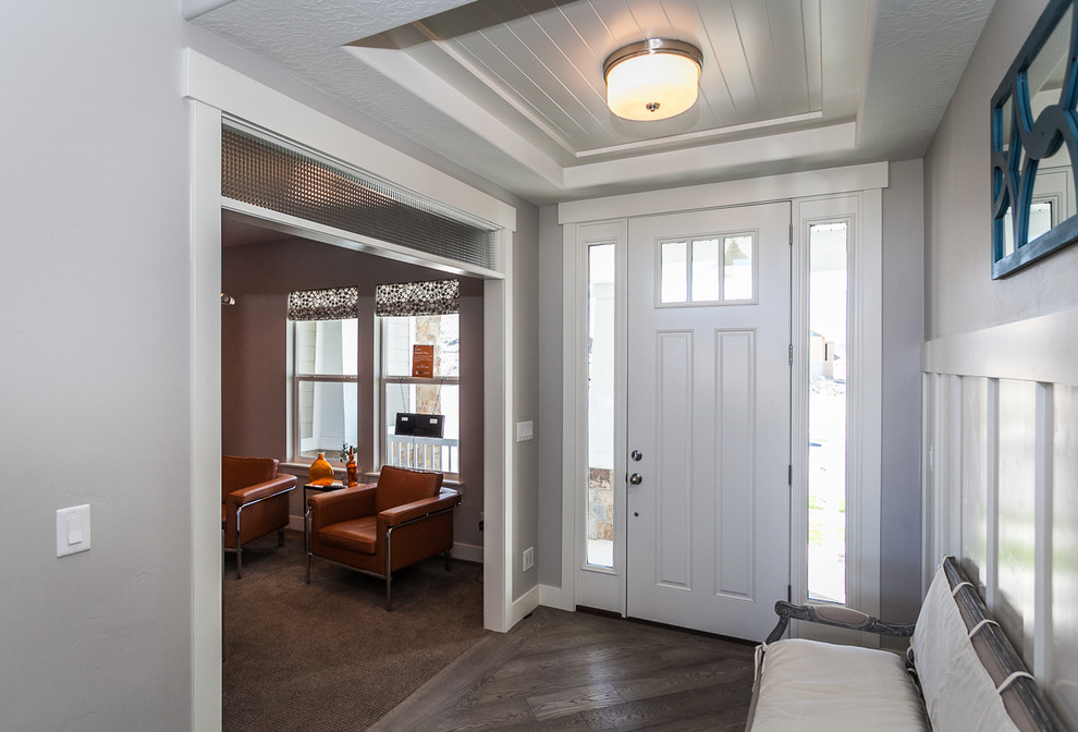 Example of a mid-sized arts and crafts entryway design in Salt Lake City with white walls and a white front door