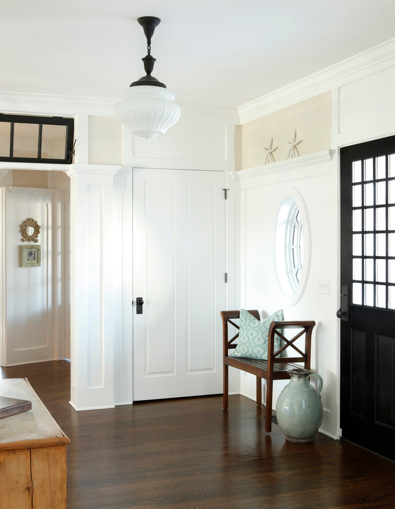 Inspiration for a traditional foyer in New York with a single front door and a black front door.