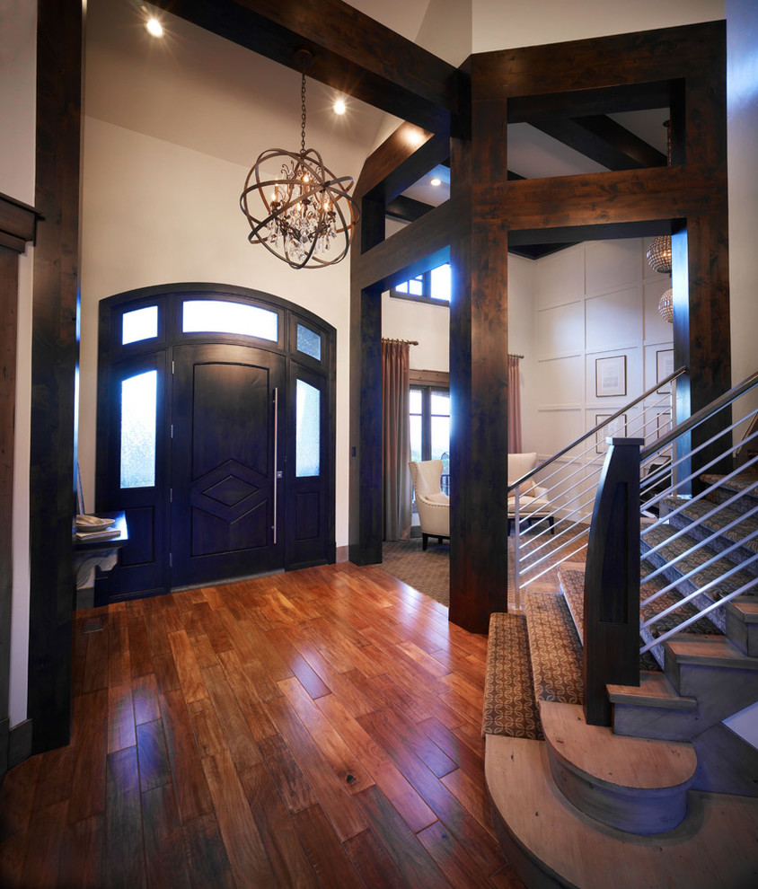 Large elegant dark wood floor entryway photo in Salt Lake City with beige walls and a dark wood front door