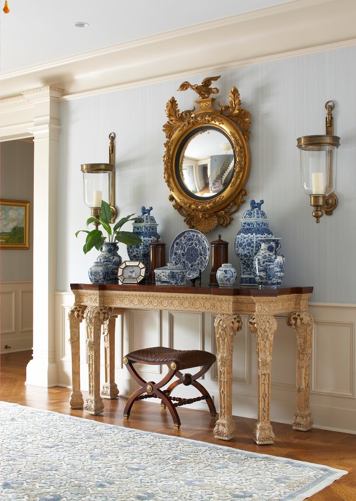 Entryway - large traditional dark wood floor and brown floor entryway idea in New York with blue walls and a glass front door