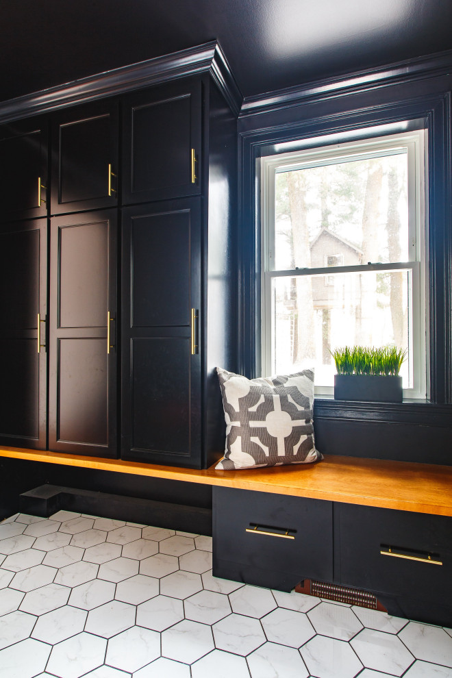 Design ideas for a medium sized classic boot room in Boston with black walls, porcelain flooring, a pivot front door, a black front door and white floors.