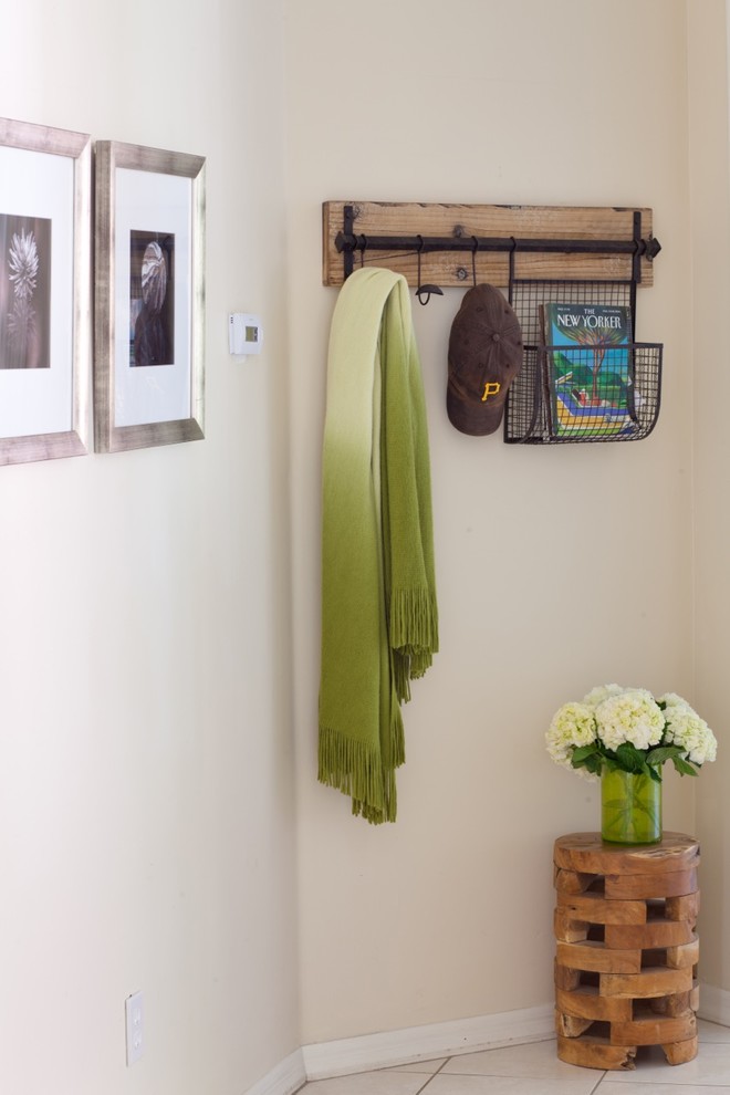 Inspiration for a small country ceramic tile entryway remodel in Phoenix with beige walls