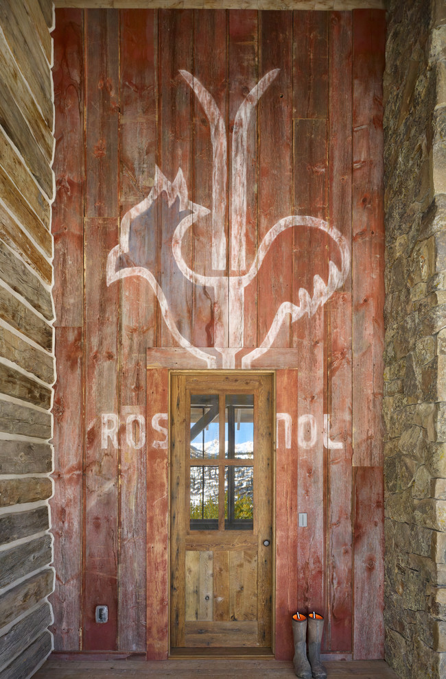 Inspiration for a mid-sized rustic single front door remodel in Denver
