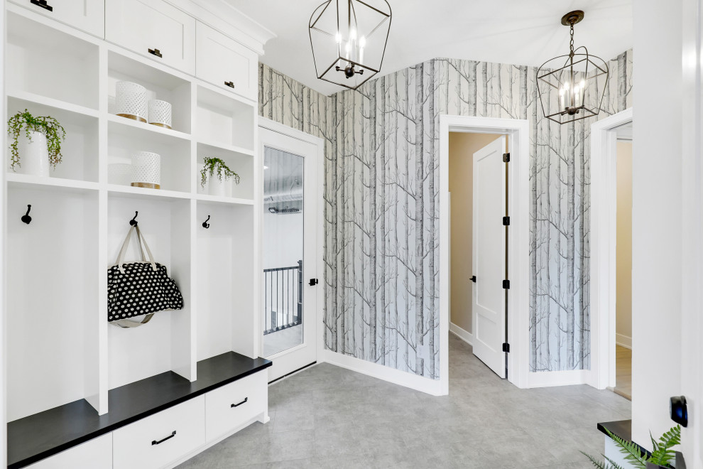 Inspiration for a transitional gray floor mudroom remodel in Minneapolis with white walls