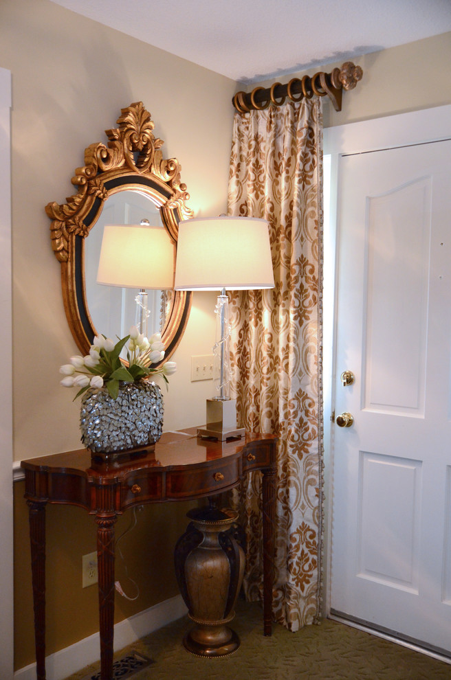 Mid-sized elegant carpeted entryway photo in Other with beige walls and a white front door