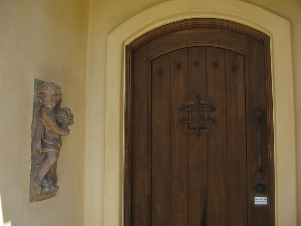 Tuscan entryway photo in Sacramento