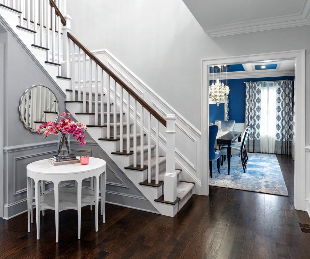 Inspiration for a medium sized beach style foyer in New York with grey walls, dark hardwood flooring, a single front door, a white front door and brown floors.