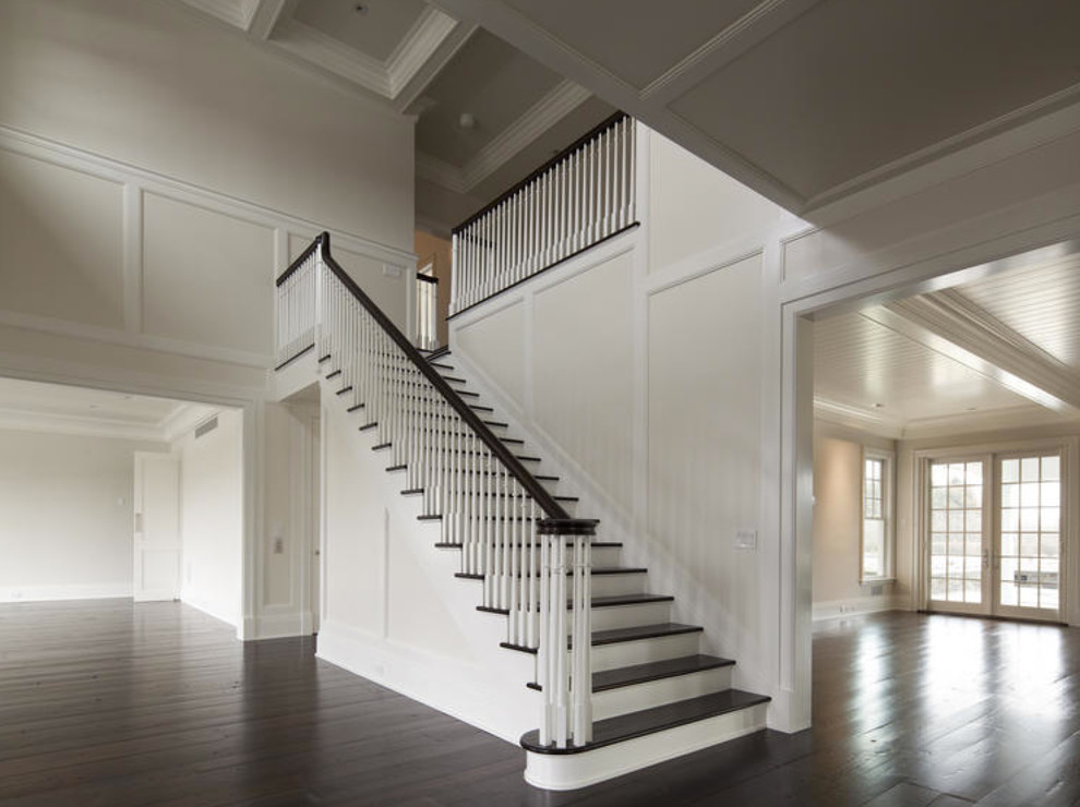 Inspiration for a large classic foyer in New York with a double front door, white walls, dark hardwood flooring, a white front door and brown floors.