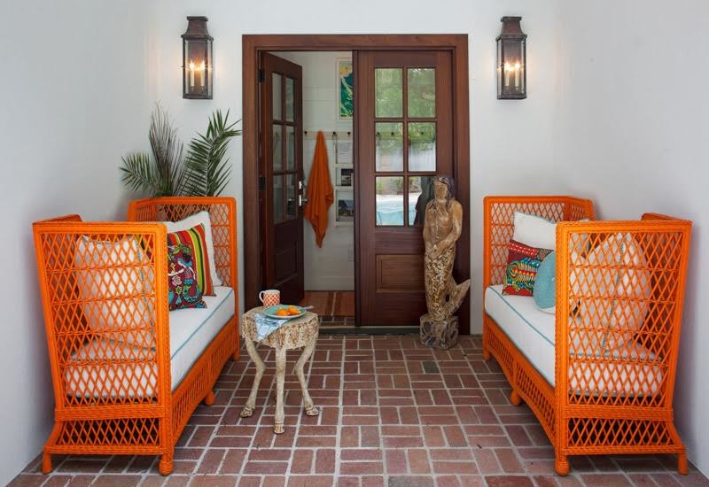 Entryway - mid-sized coastal brick floor and brown floor entryway idea in Jacksonville with white walls and a dark wood front door
