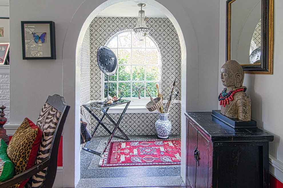Eclectic entryway photo in San Francisco with white walls