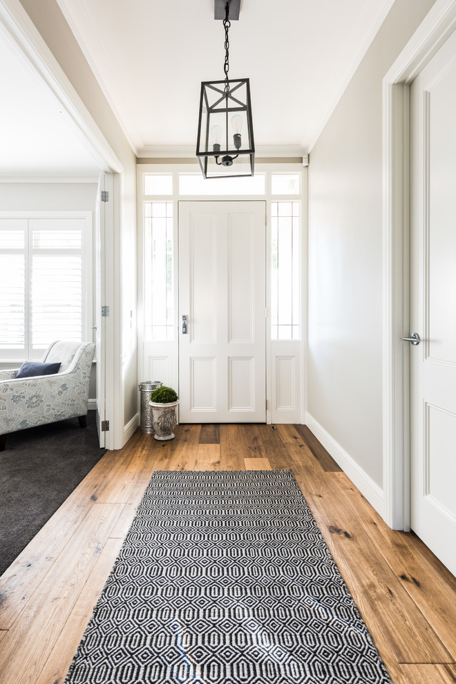 Inspiration for a classic front door in Melbourne with white walls, a single front door and a white front door.