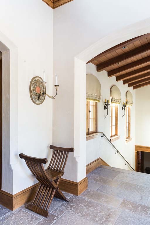 Example of a mid-sized tuscan entry hall design in San Francisco with white walls