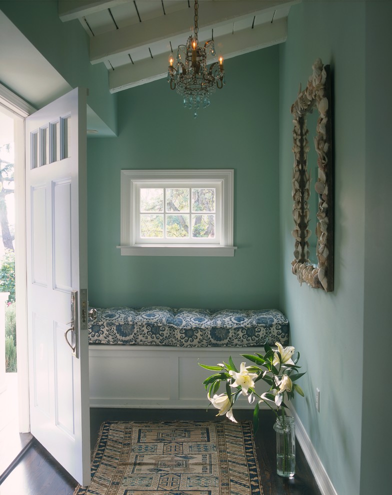 Example of a small classic single front door design in Los Angeles with blue walls