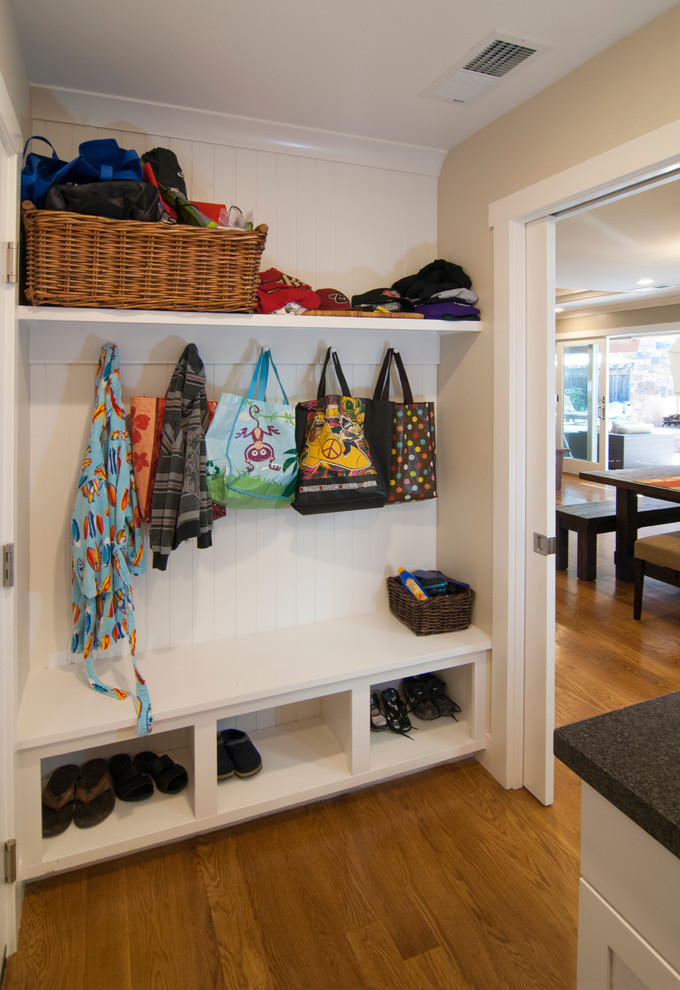 Classic boot room in San Francisco with beige walls and medium hardwood flooring.