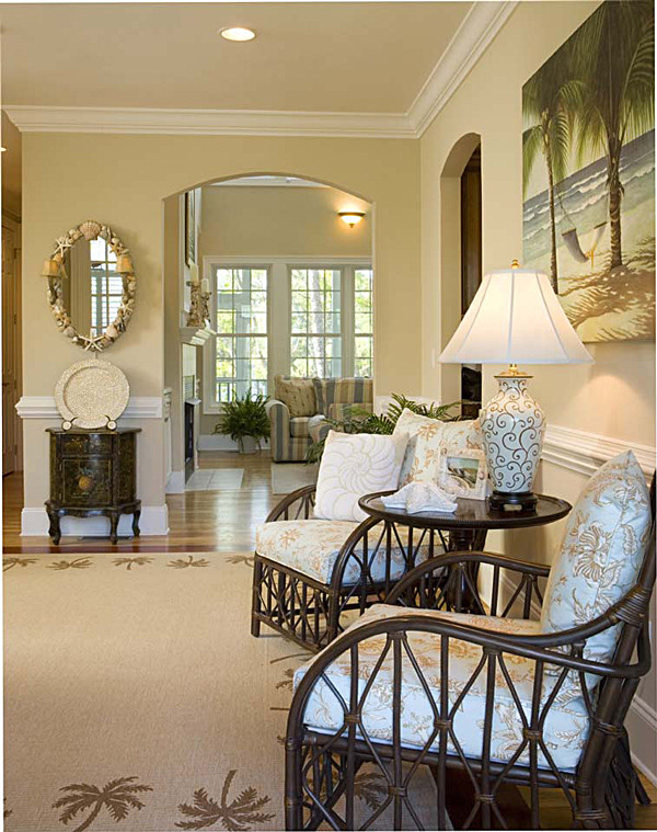 Inspiration for a large coastal foyer in Miami with beige walls, medium hardwood flooring, a single front door and a white front door.