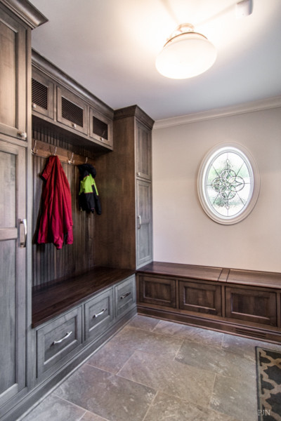 Mudroom - mid-sized traditional slate floor mudroom idea in Chicago with white walls