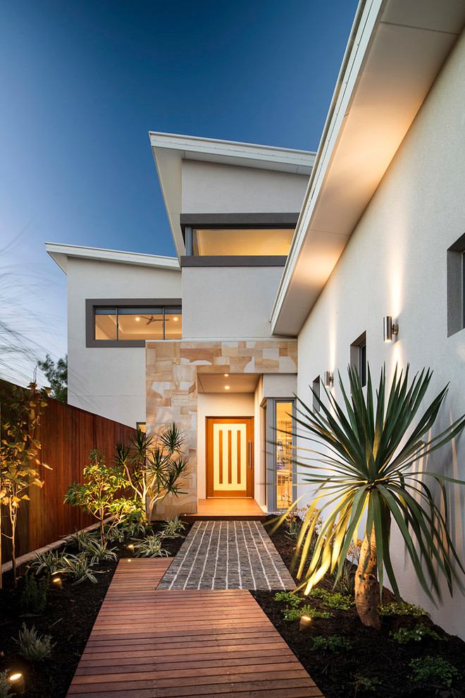 Example of a mid-sized trendy entryway design in Perth with white walls and a medium wood front door