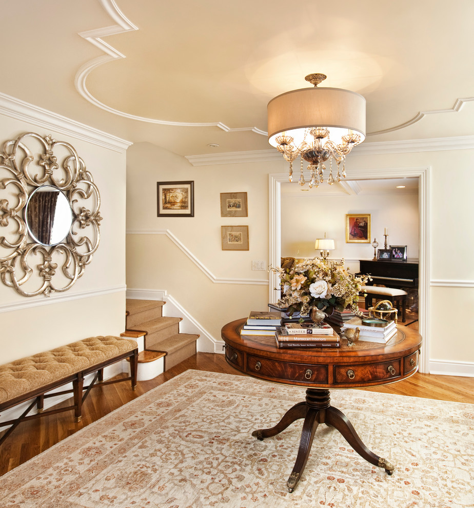 Photo of a classic foyer in New York with a dado rail.