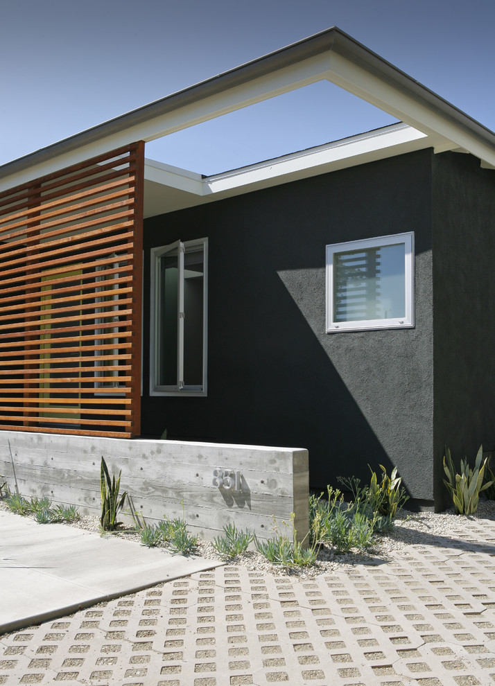 Photo of a small contemporary front door in Los Angeles with a single front door and a glass front door.