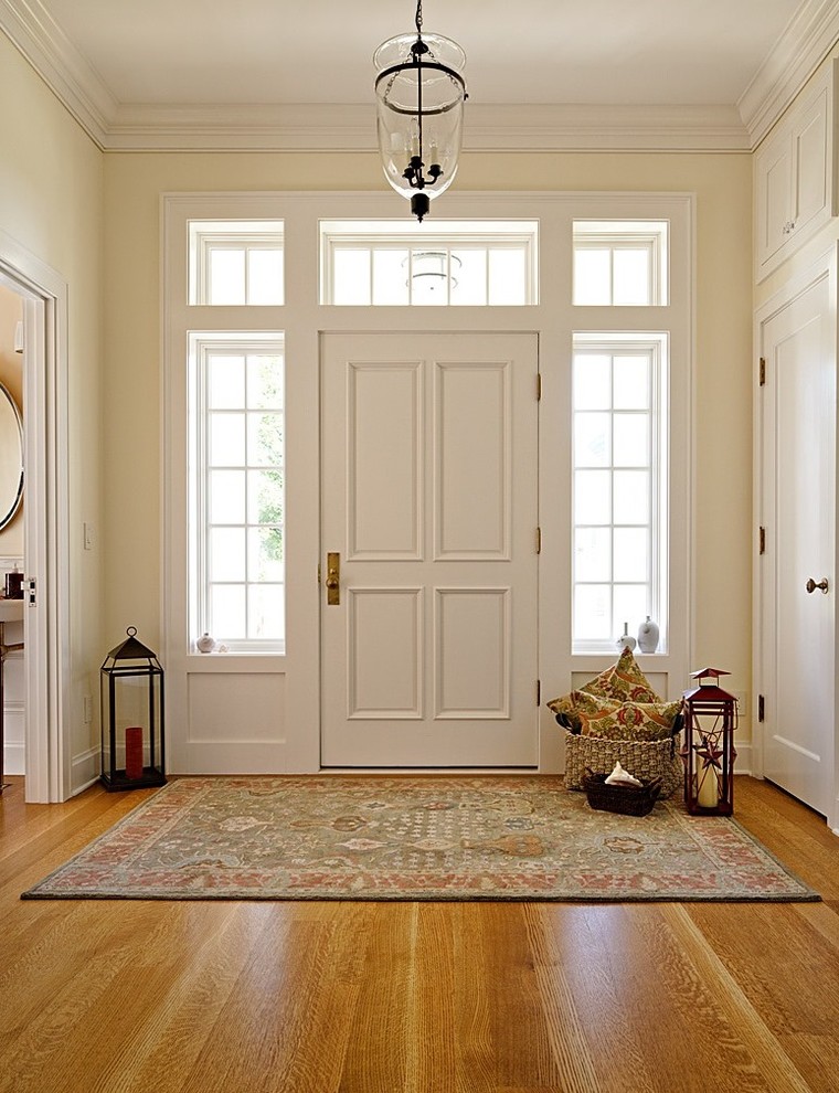 Inspiration for a medium sized nautical foyer in Seattle with yellow walls, medium hardwood flooring, a single front door and a white front door.
