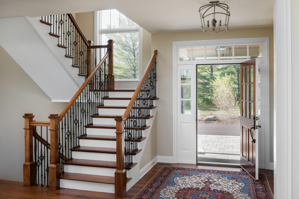 Large traditional foyer in Milwaukee with beige walls, dark hardwood flooring, a single front door, a white front door, brown floors and exposed beams.