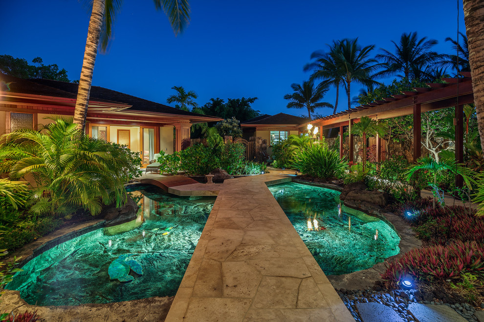 This is an example of a large world-inspired foyer in Hawaii with a double front door.