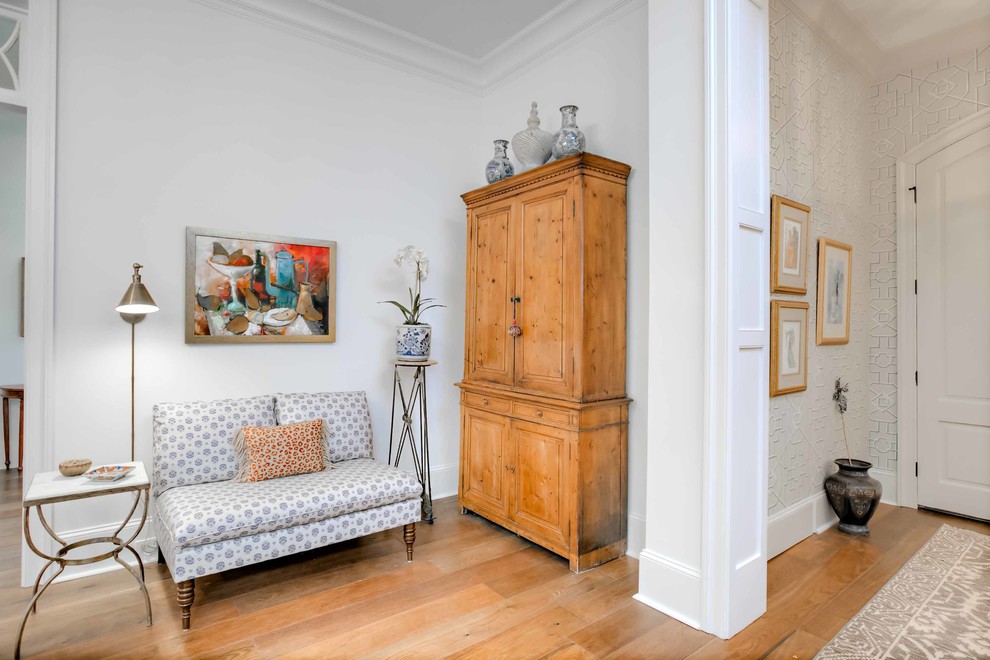 Design ideas for a large classic foyer in New Orleans with multi-coloured walls, medium hardwood flooring, a double front door, a white front door and brown floors.