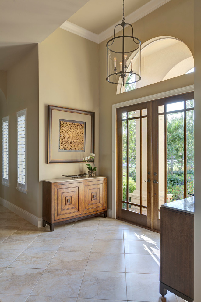 Example of a transitional entryway design in Miami with beige walls