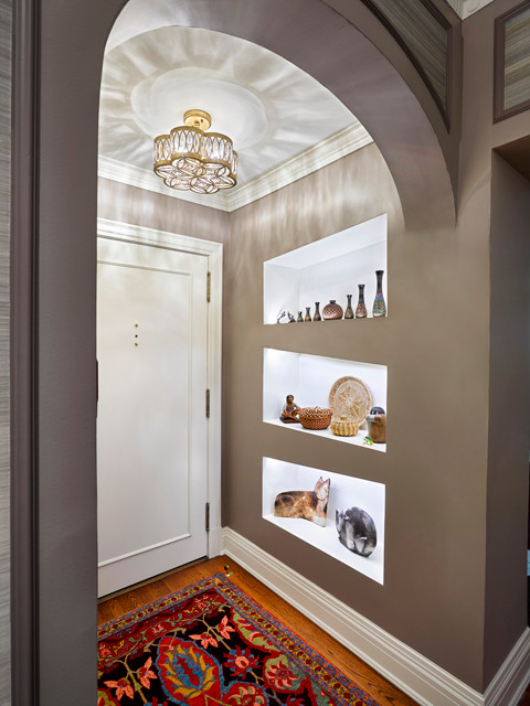 Example of a small transitional medium tone wood floor and brown floor entryway design in Cleveland with gray walls and a white front door