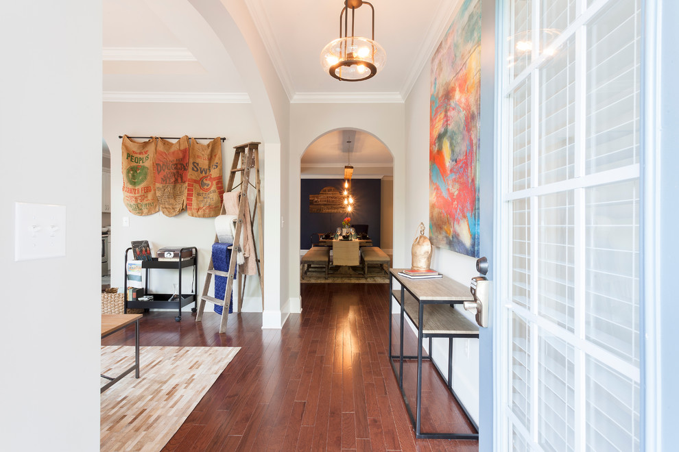 Photo of a medium sized bohemian foyer in Nashville with beige walls, medium hardwood flooring and a blue front door.