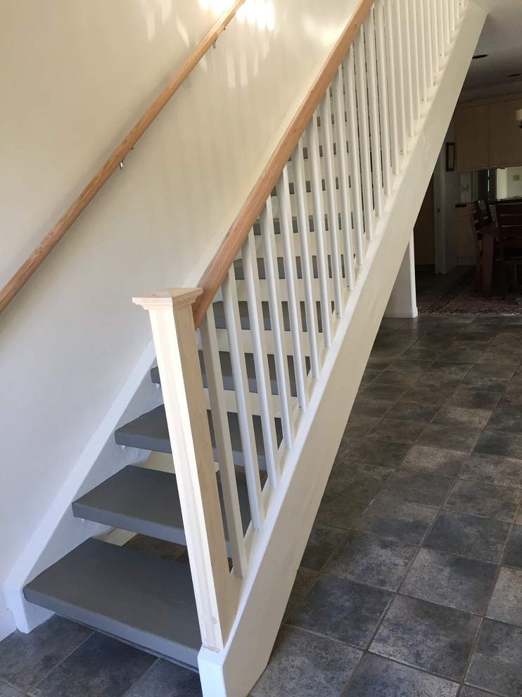 Simple Craftsman style banister in La Jolla Beach Style Staircase