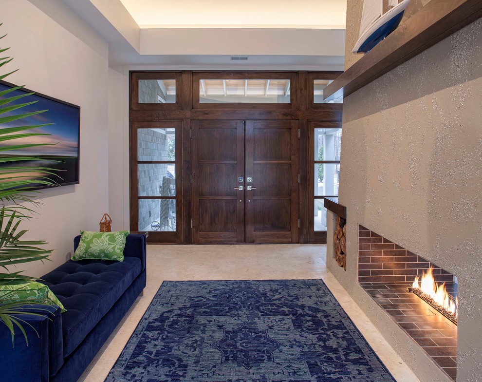 Inspiration for a contemporary beige floor entryway remodel in Other with a medium wood front door