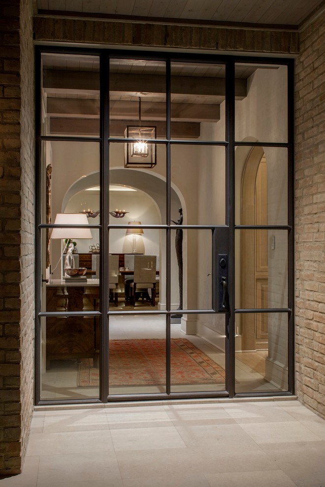 Inspiration for a huge contemporary single front door remodel in Austin with white walls and a metal front door