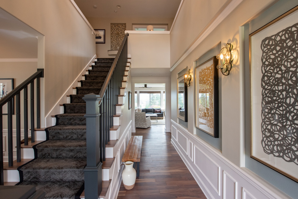 Photo of a large classic foyer in Seattle with beige walls, medium hardwood flooring and brown floors.