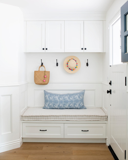 coastal mudroom with bench and pillows
