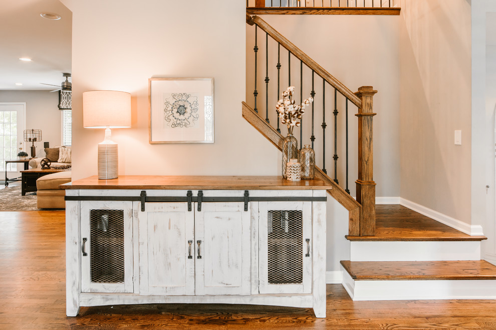 Photo of a medium sized industrial foyer in Chicago with grey walls, medium hardwood flooring, a single front door, a medium wood front door and brown floors.