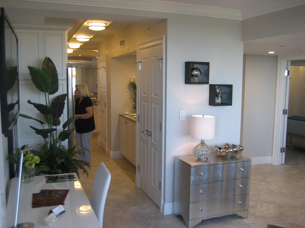 Photo of a medium sized contemporary hallway in Miami with grey walls.