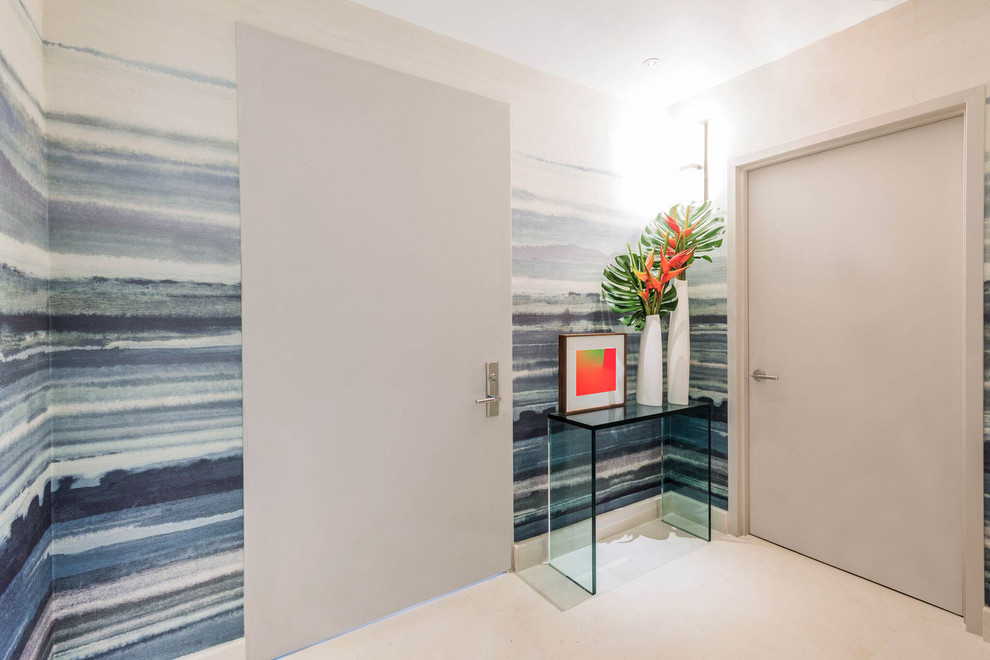 Photo of a large contemporary foyer in Miami with multi-coloured walls, porcelain flooring, a single front door, a white front door and white floors.