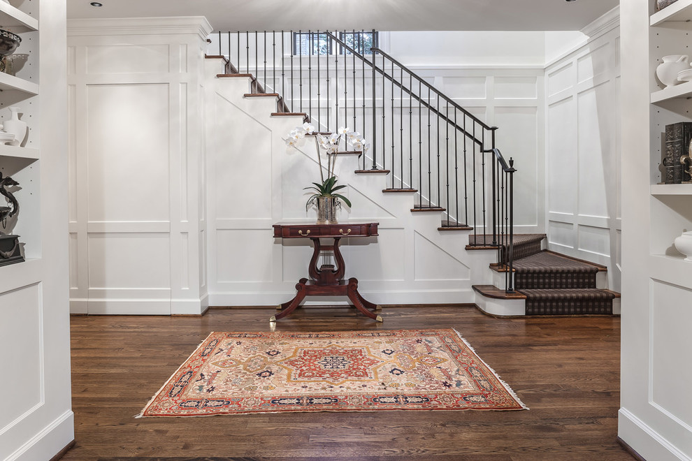 Inspiration for a traditional foyer in Houston with white walls.