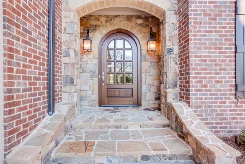Design ideas for a medium sized traditional front door in Atlanta with a single front door and a dark wood front door.