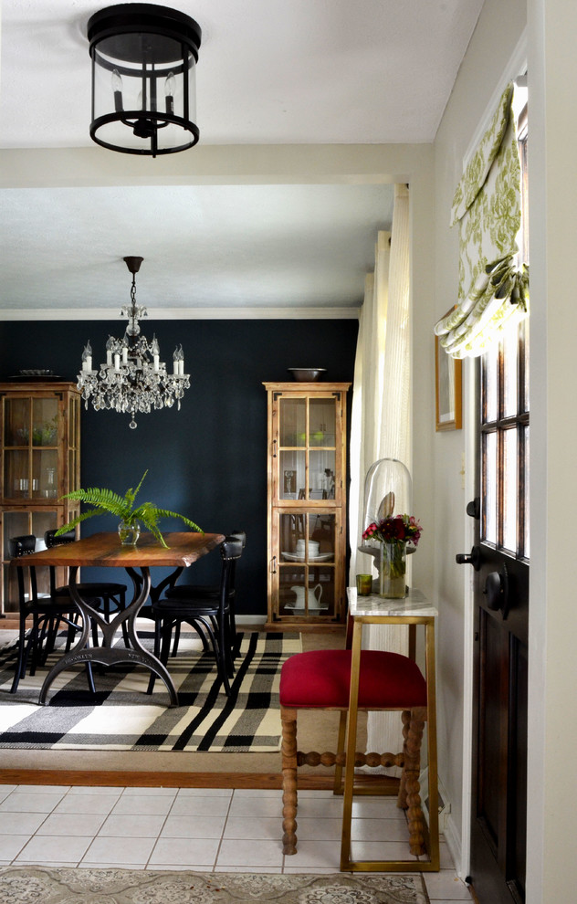 Inspiration for a small eclectic entryway remodel in Houston with gray walls and a dark wood front door