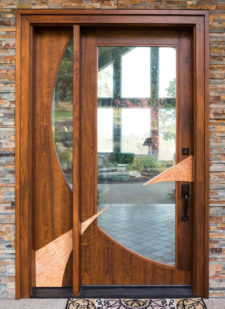Large midcentury front door in Portland with a single front door and a medium wood front door.
