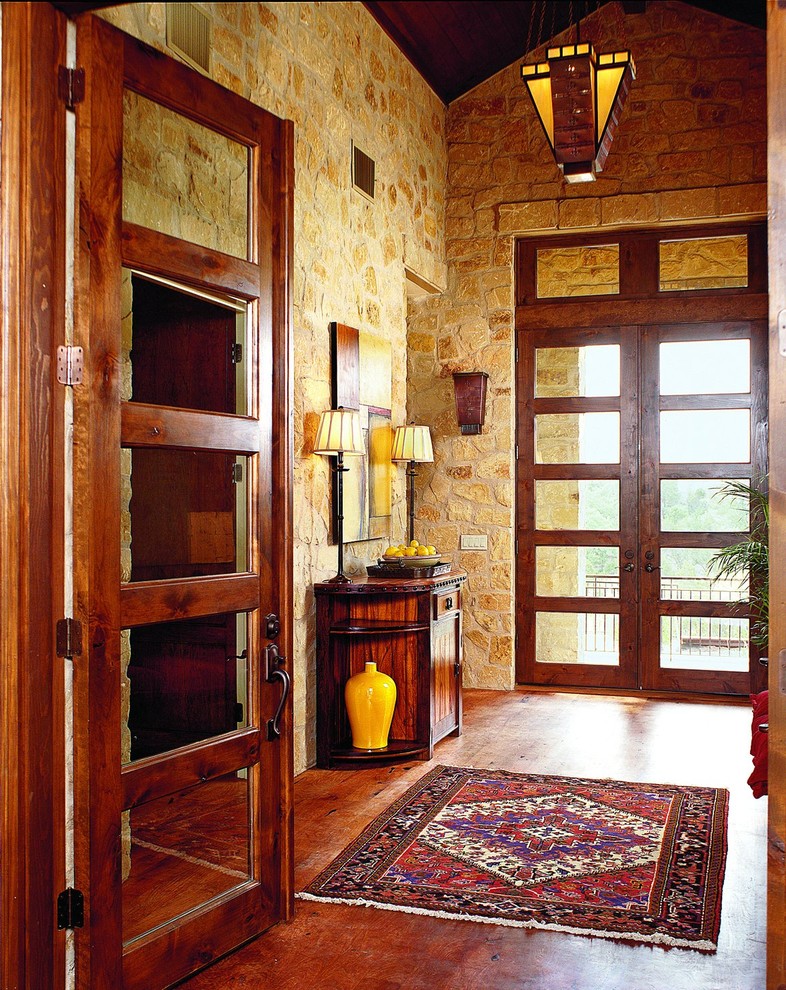Eclectic vestibule in Austin with a double front door, a glass front door and feature lighting.