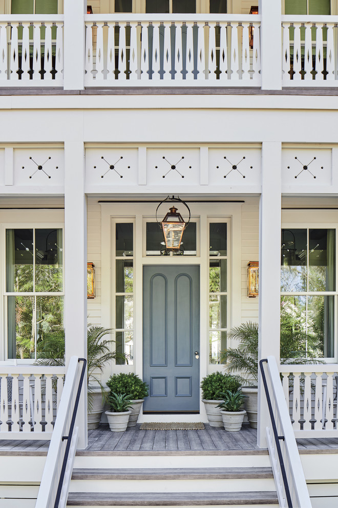 Beach style entryway photo in Jacksonville with a gray front door