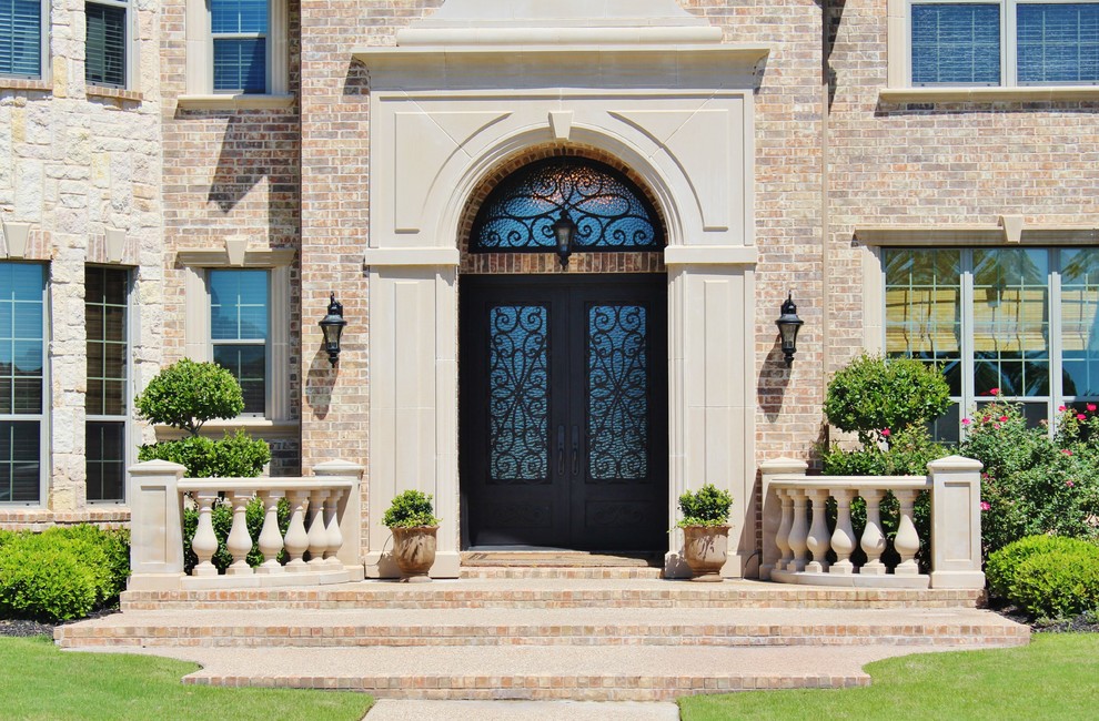 Photo of a classic front door in Dallas with a double front door and a metal front door.