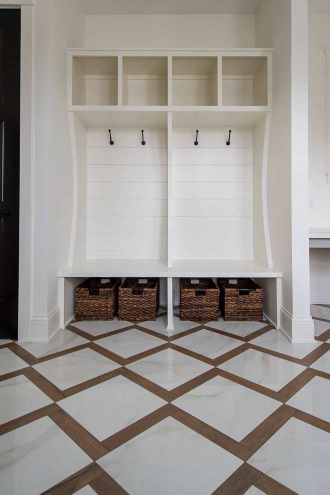Front door - mid-sized contemporary marble floor front door idea in Indianapolis with beige walls