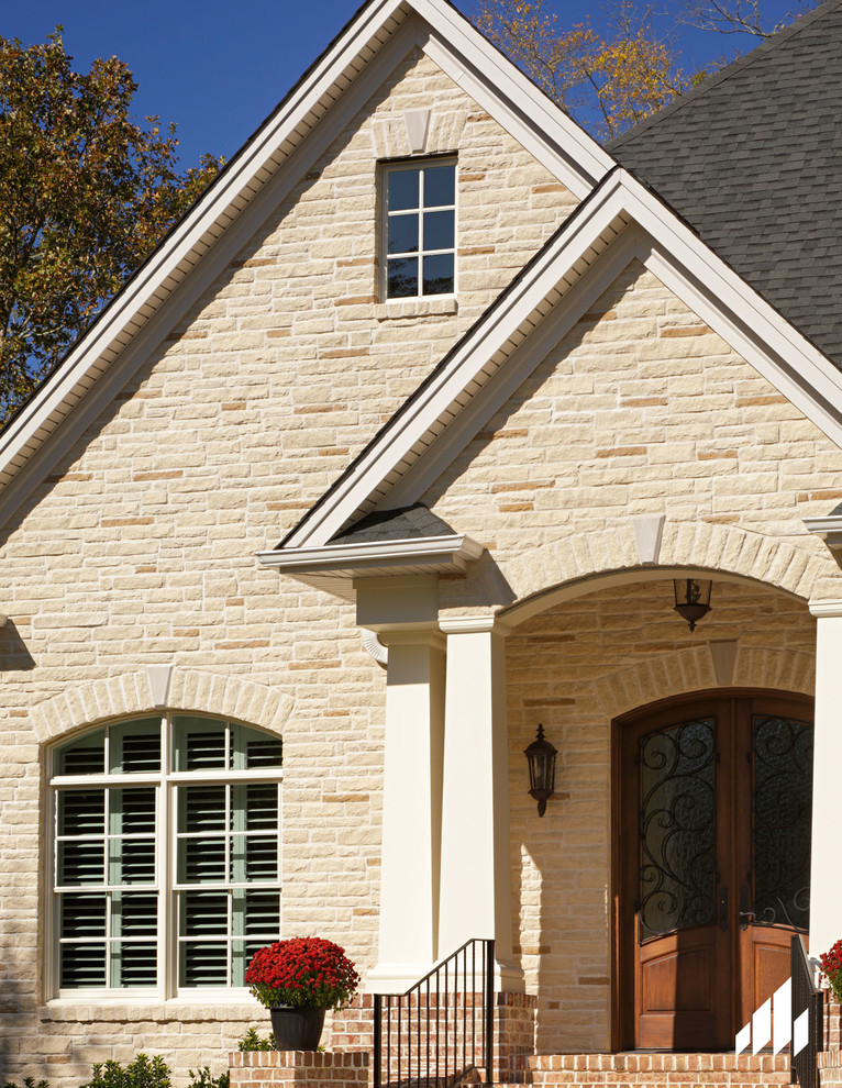 Spalding Tudor Brick Home featuring Sugarcane Brown Stone South