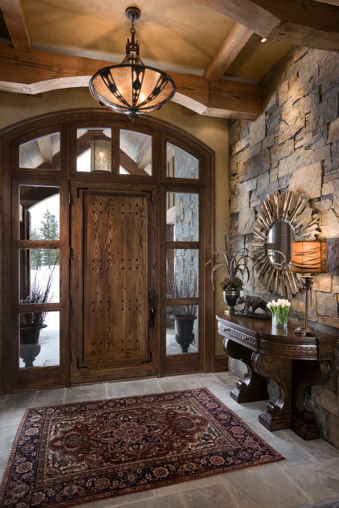 Rustic front door in Other with a single front door and feature lighting.